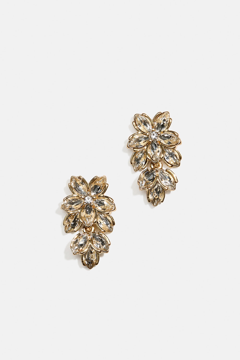 Kullanväriset korvakorut, joissa kukkia, lasikiviä ja lehti ryhmässä Store week / @ Glitter (253010270202)