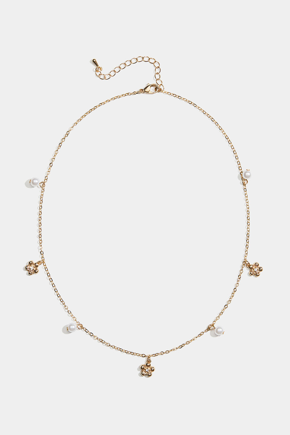 Kullanvärinen kaulakoru, jossa kukkia ja valkoisia helmiä ryhmässä Store week / @ Glitter (254002572002)