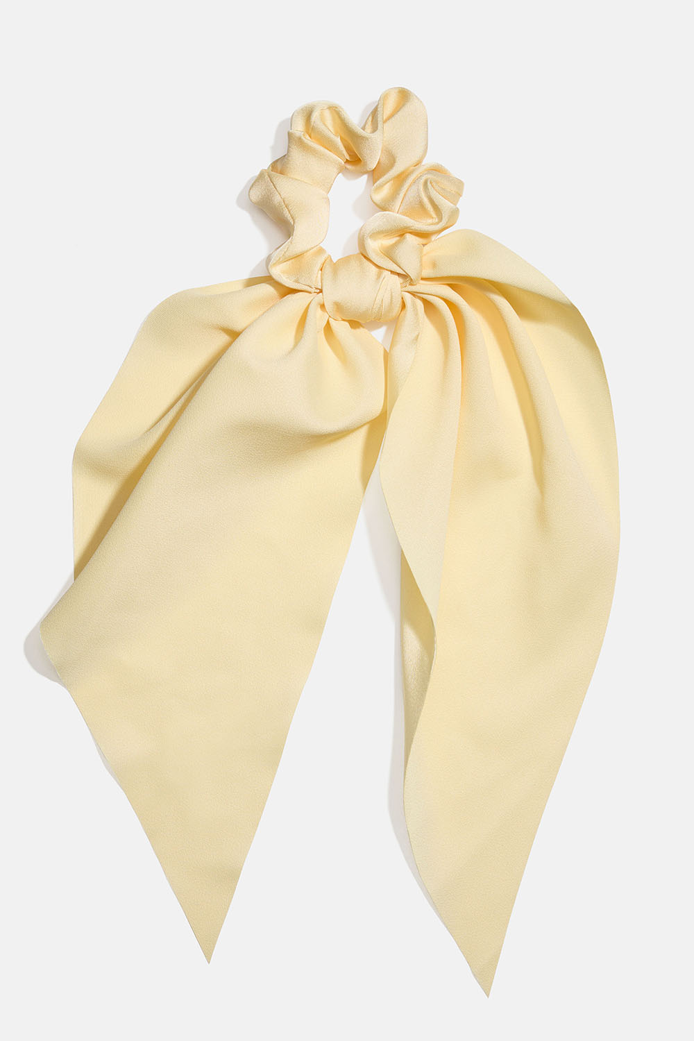 Hännällinen keltainen hiusdonitsi ryhmässä Hiustuotteet / Scrunchie-hiusdonitsit / Scrunchiet huivikuvioilla @ Glitter (332001654000)