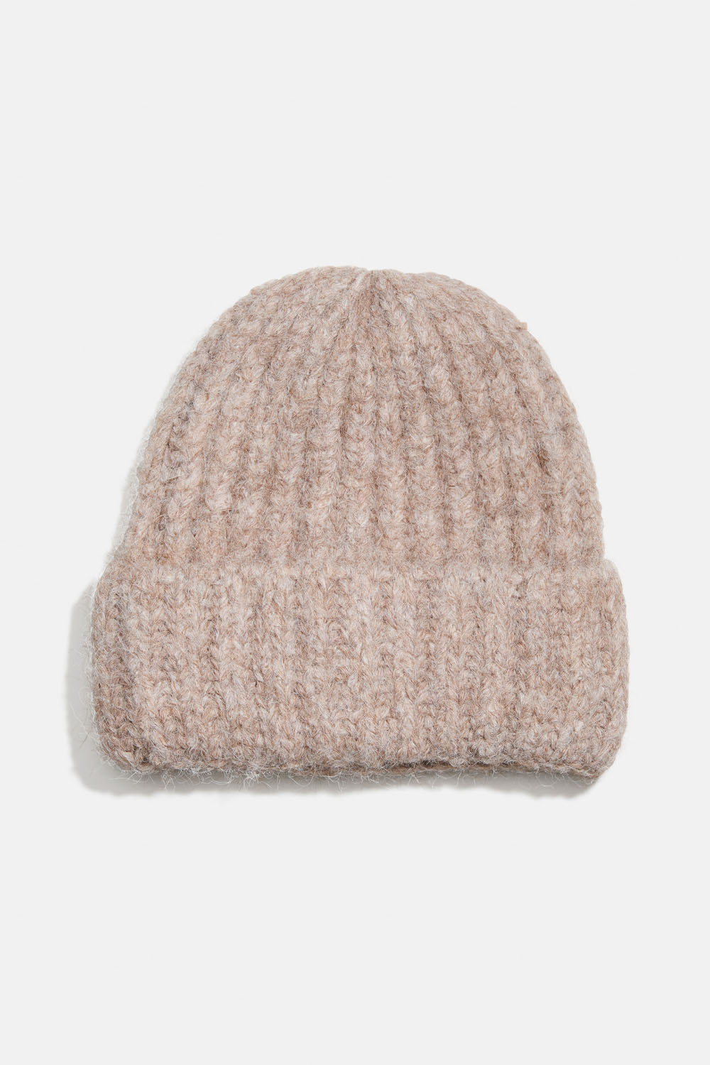 Villasekoitteesta valmistettu beige joustoneulepipo