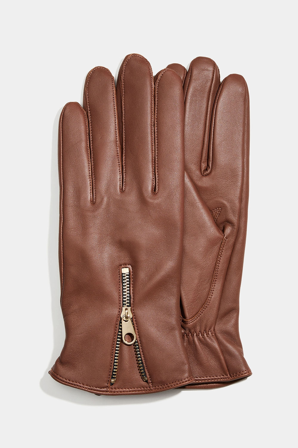 Ruskeat nahkakäsineet, joiden sivussa vetoketju