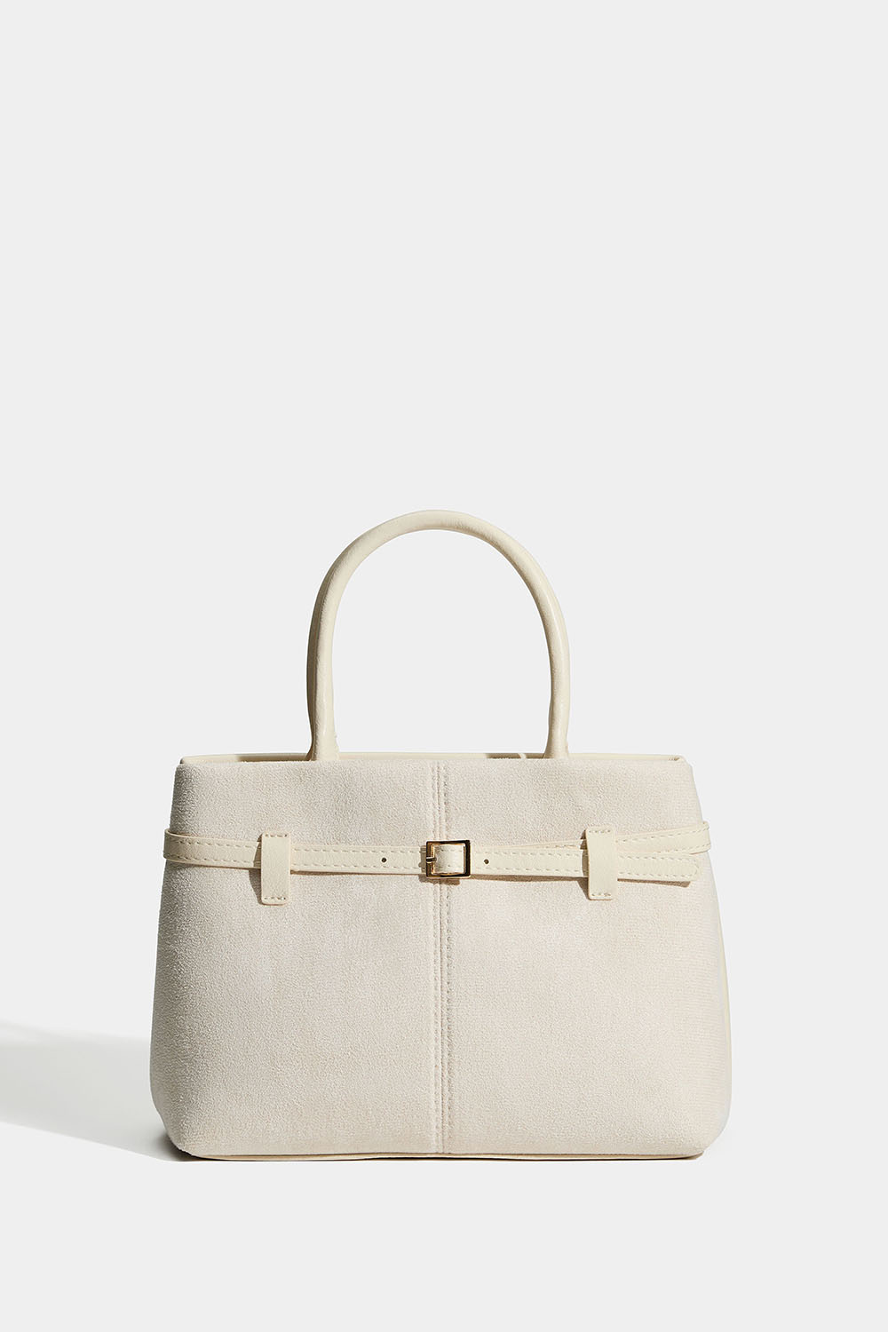 Pieni beige laukku, jossa vyöyksityiskohta