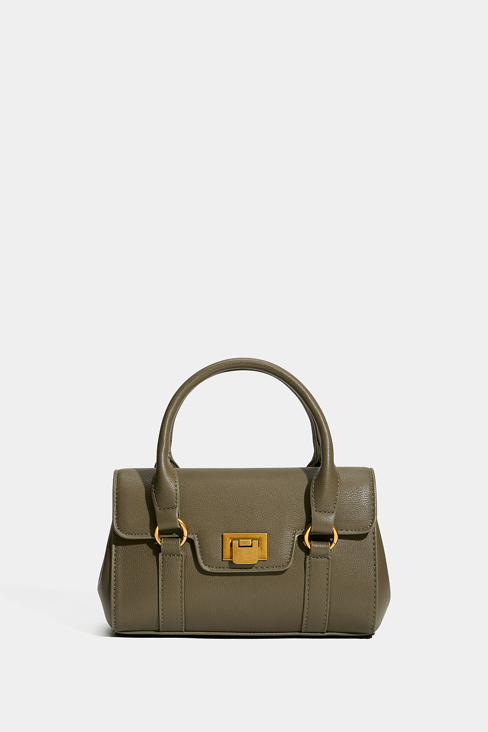 Pieni vihreä käsilaukku kaksinkertaisella kahvalla