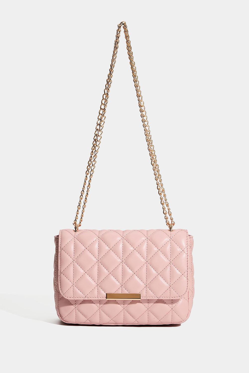 Vaaleanpunainen laukku, jossa on tikattu kuvio ja kullanvärinen olkahihna.