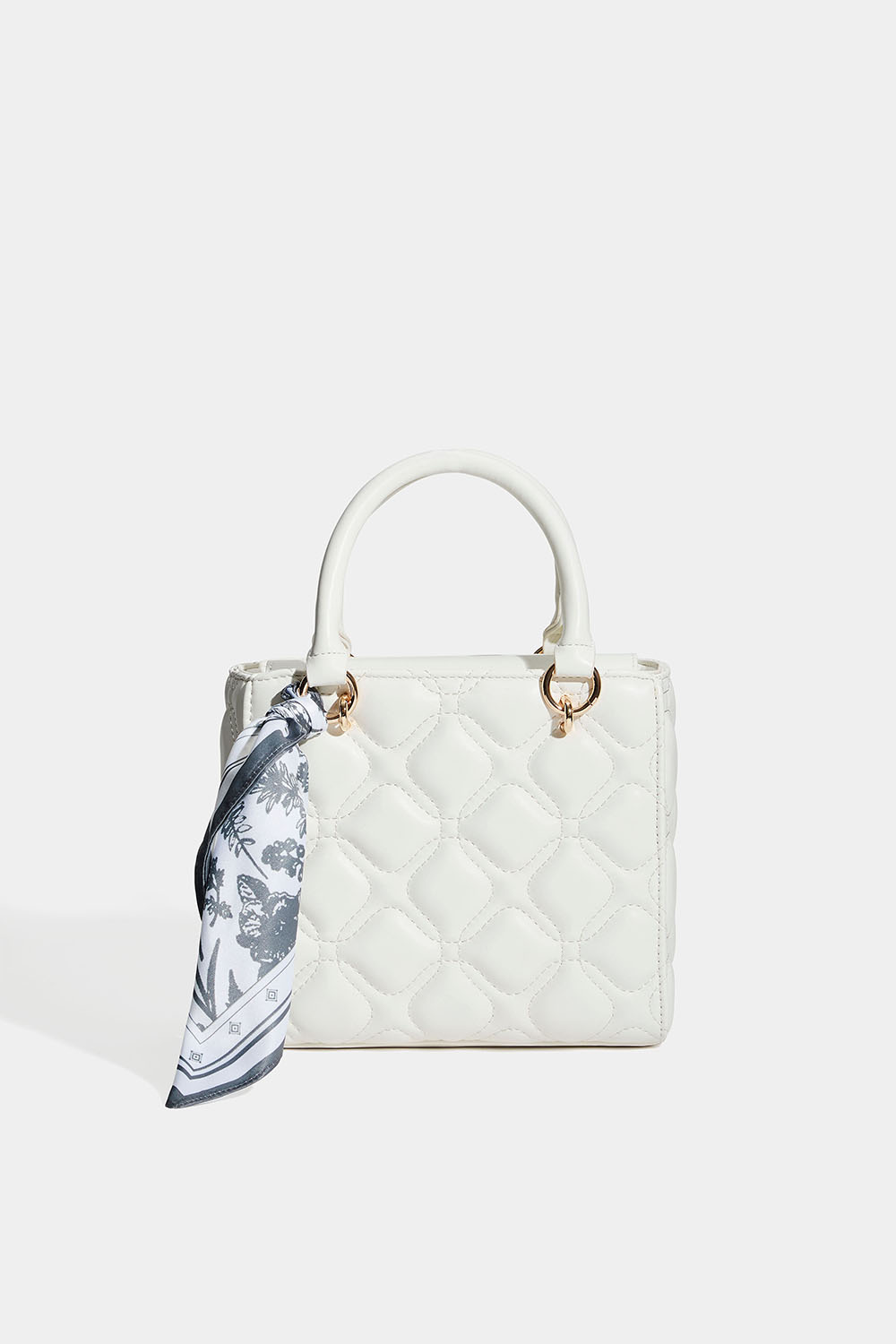 Valkoinen tikattu laukku ja huivi