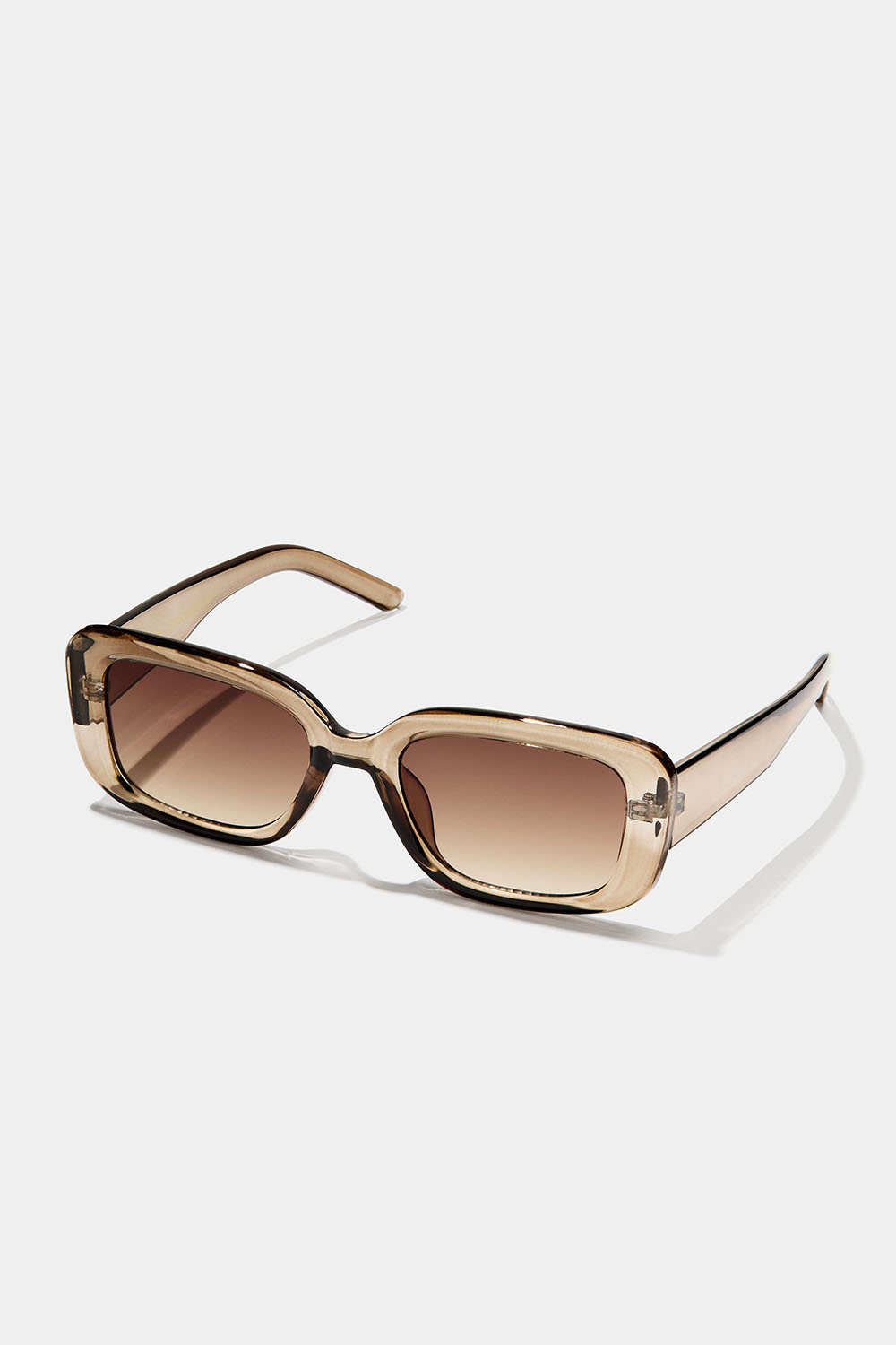 Kulmikkaat aurinkolasit, joissa on läpinäkyvät vaaleanruskeat kehykset