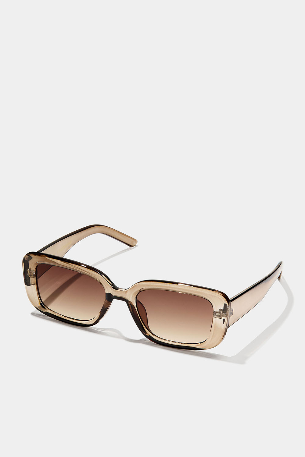 Kulmikkaat aurinkolasit, joissa on läpinäkyvät vaaleanruskeat kehykset