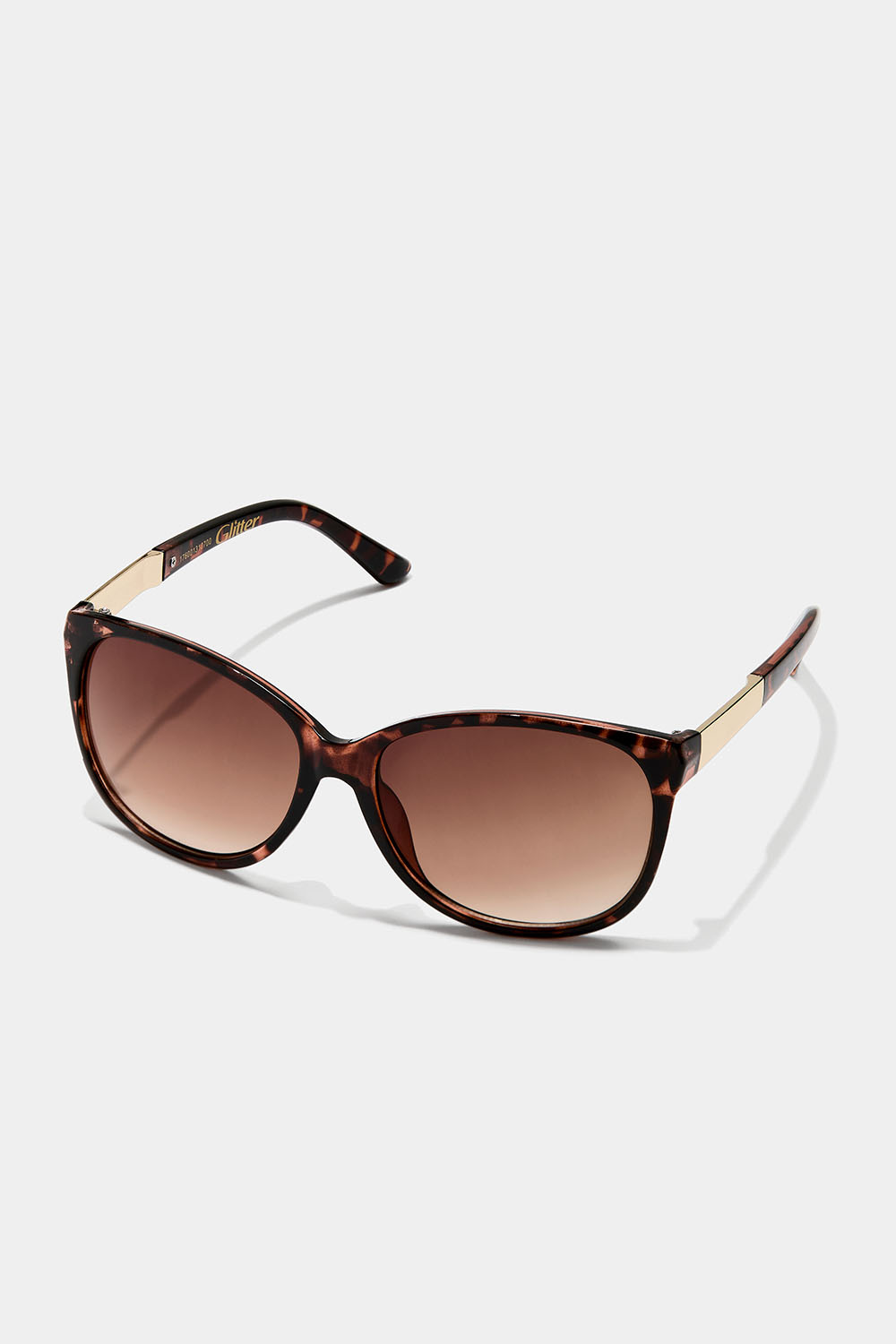 Kilpikonnakuvioiset aurinkolasit, joissa metalliyksityiskohtia