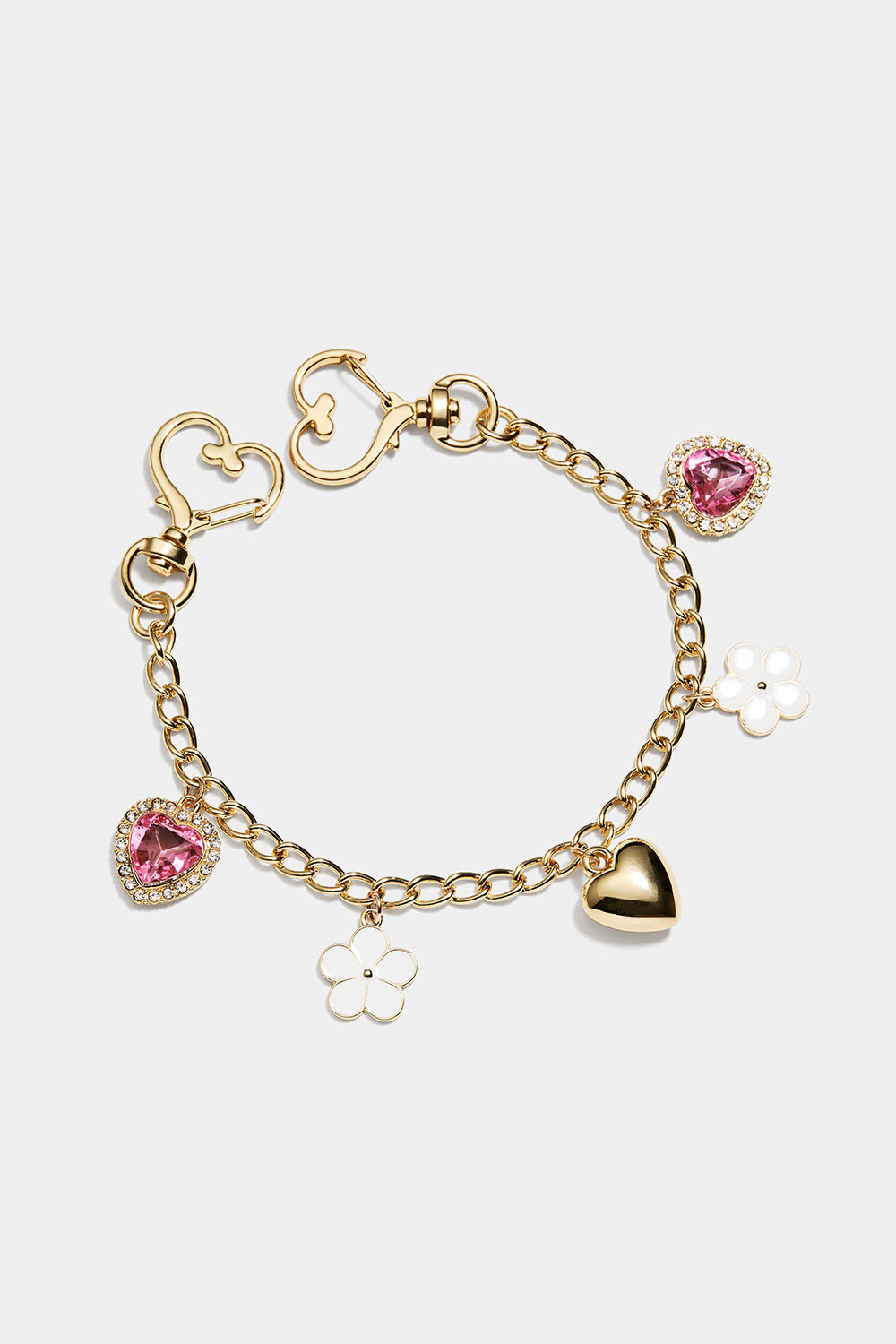 Laukkukoriste kukalla ja sydämellä