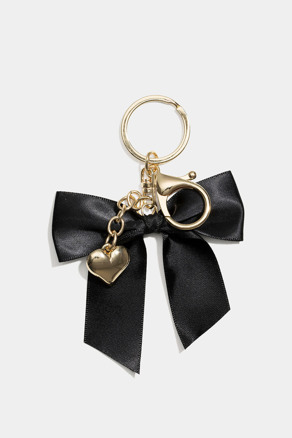 Laukkukoriste rusetilla ja sydämellä