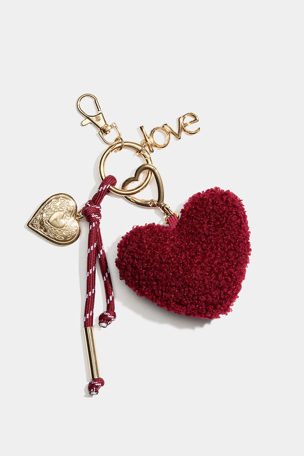 Laukkukoriste, jossa sydän ja riipus