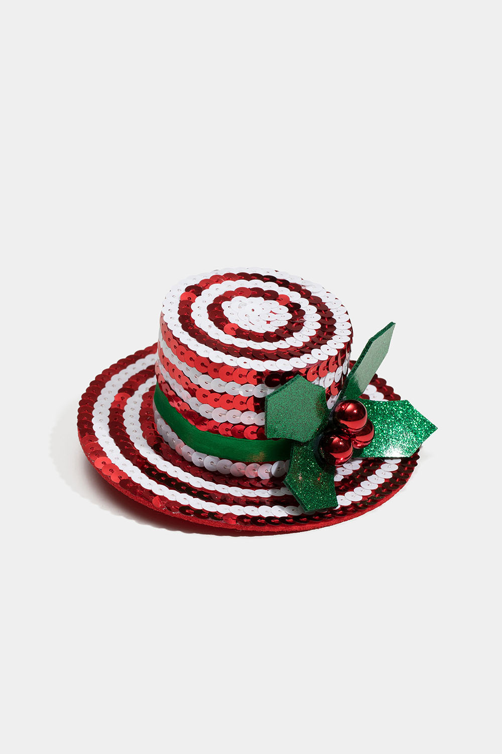 Hiussolki, jossa on pieni punainen hattu ja mistelinoksa