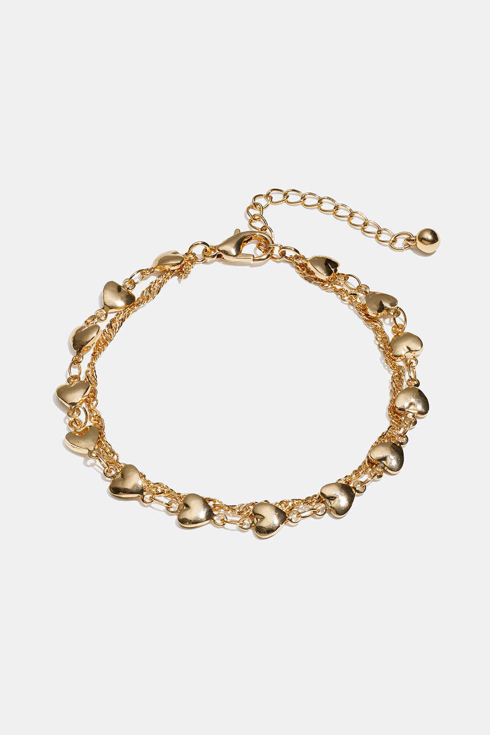 Kullavärinen kaksoisrannekoru, jossa sydämiä