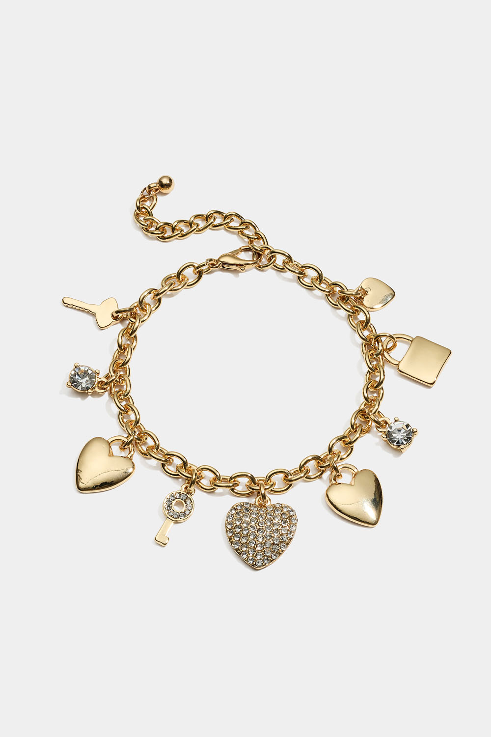 Kullanvärinen rannekoru, jossa on avaimia ja sydämiä