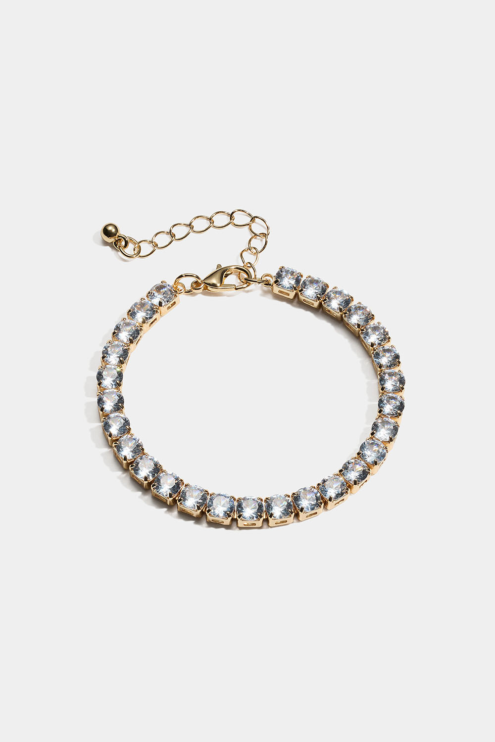 Kullanvärinen rannekoru, jossa on nelikulmaisia lasikiviä.