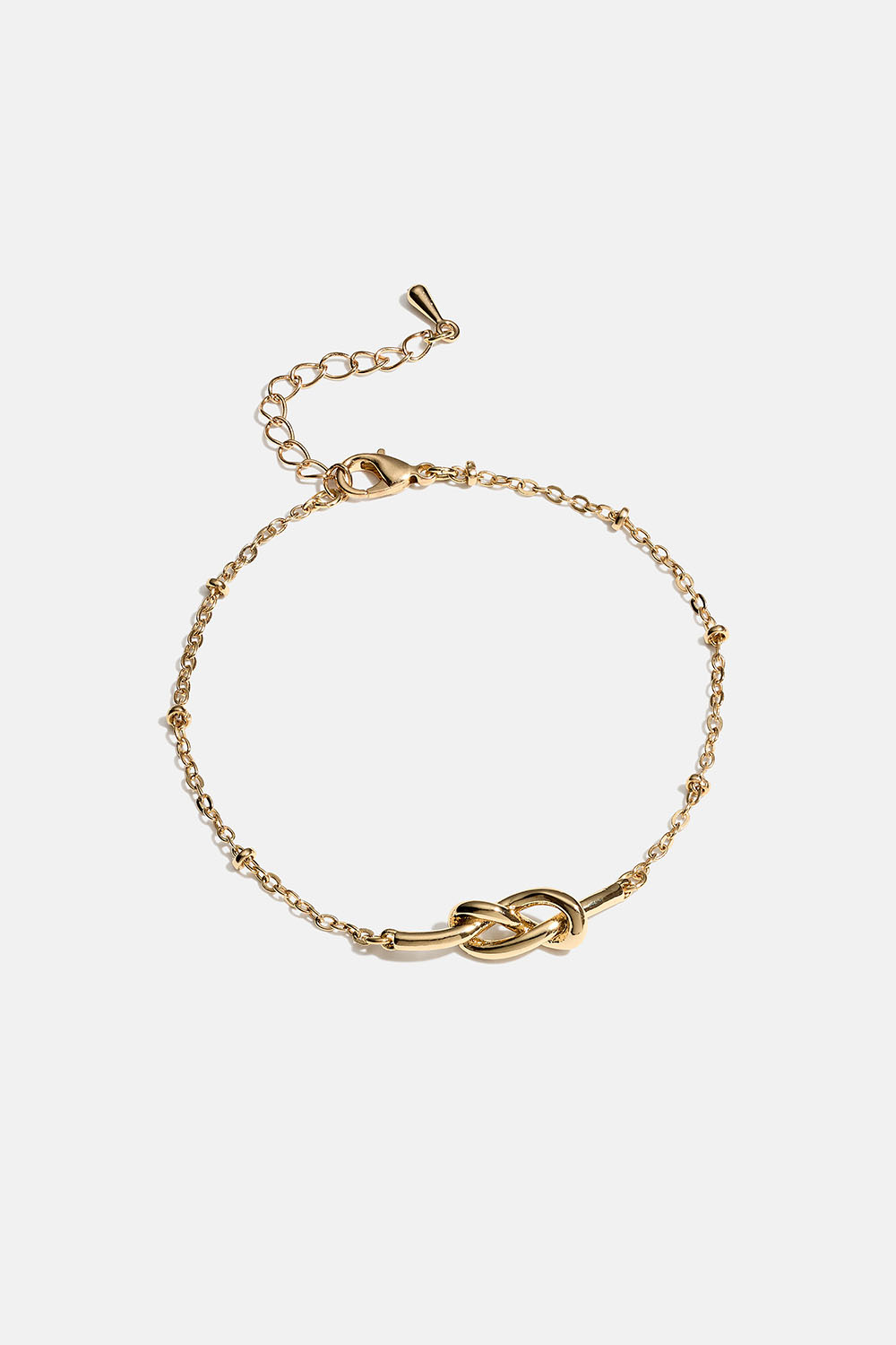 Kullanvärinen rannekoru, jossa solmu