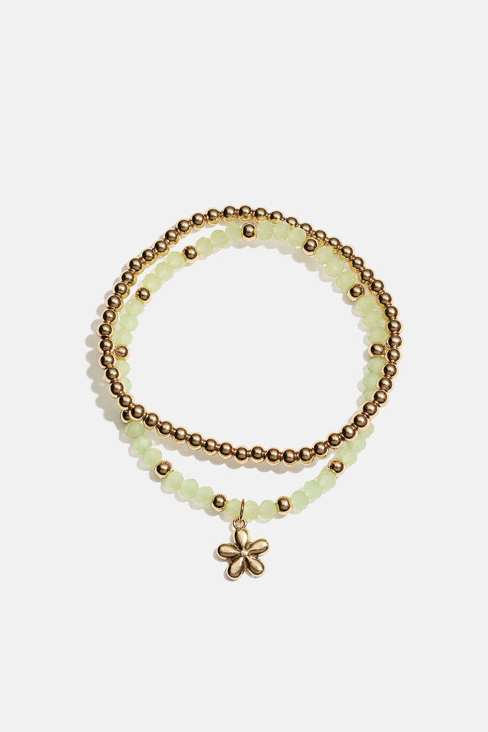 Joustavat rannekorut, joissa kukka sekä vihreitä ja kullanvärisiä helmiä, 2 kpl