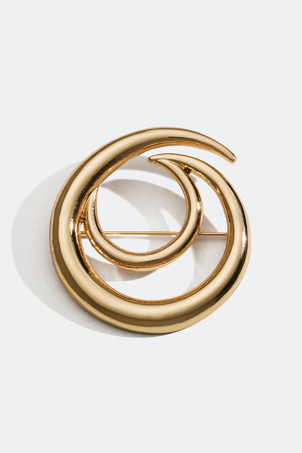 Pyöreä kullanvärinen rintakoru