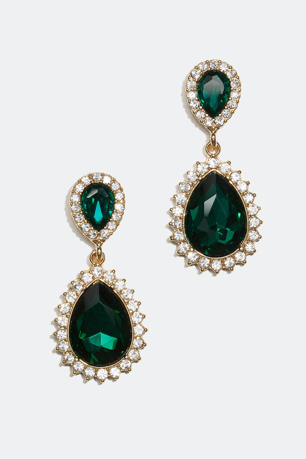 Pisaranmuotoiset korvakorut, joissa valkoisia ja vihreitä lasikiviä