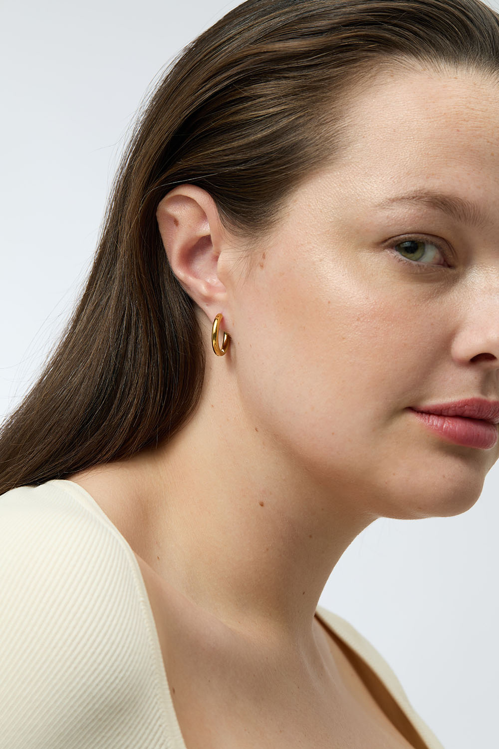 Teräksiset rengaskorvakorut 18K kultauksella