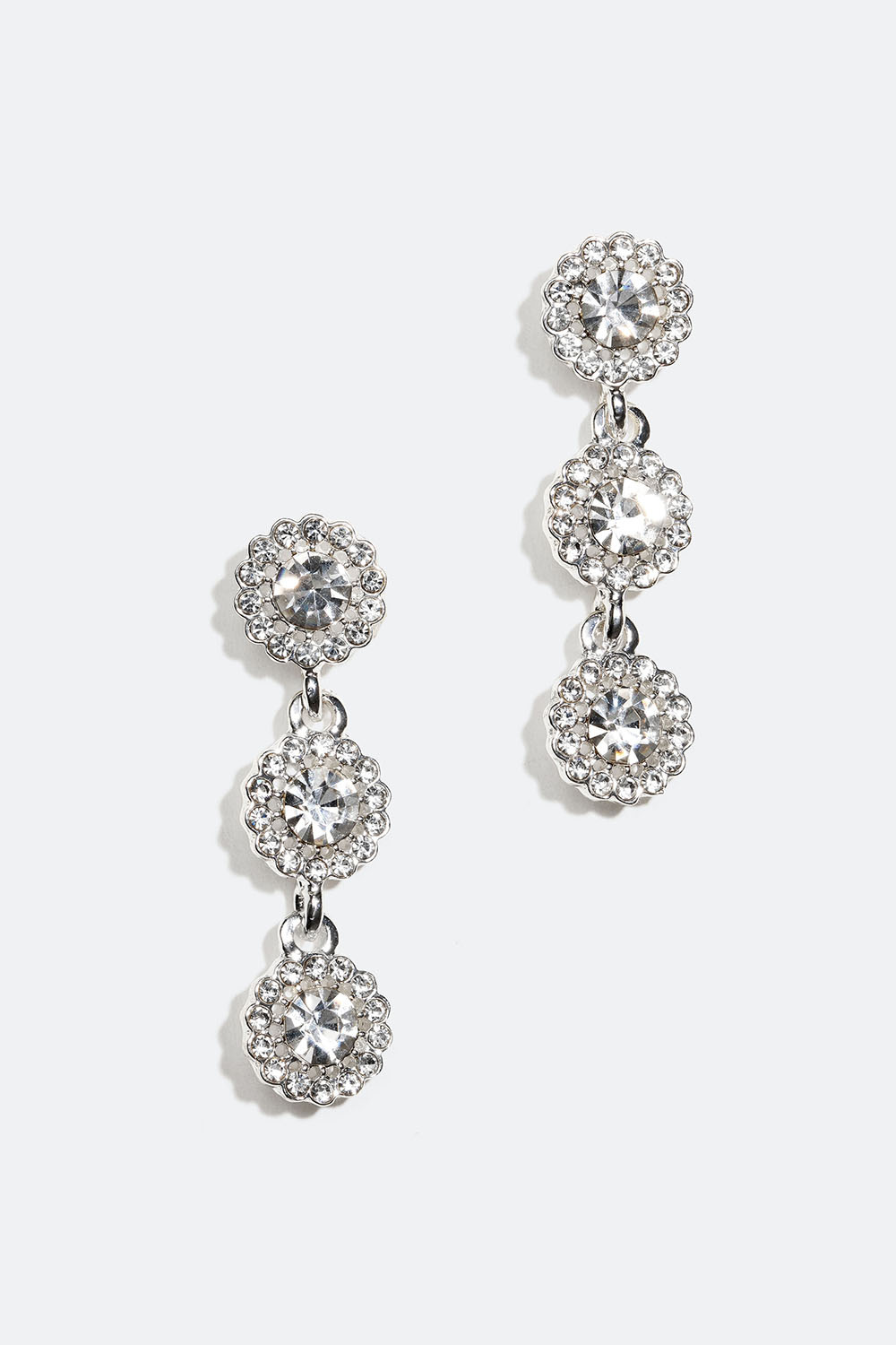 Strassikorvakorut, joissa kolme pyöreää lasikiveä