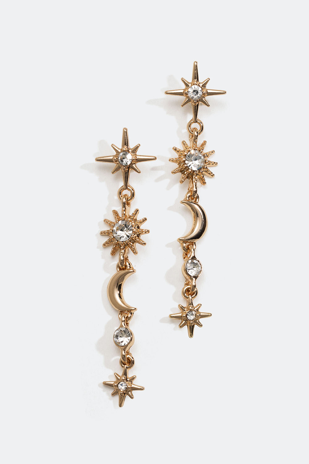 Kullanväriset korvakorut, joissa riippuu tähtiä ja kuita