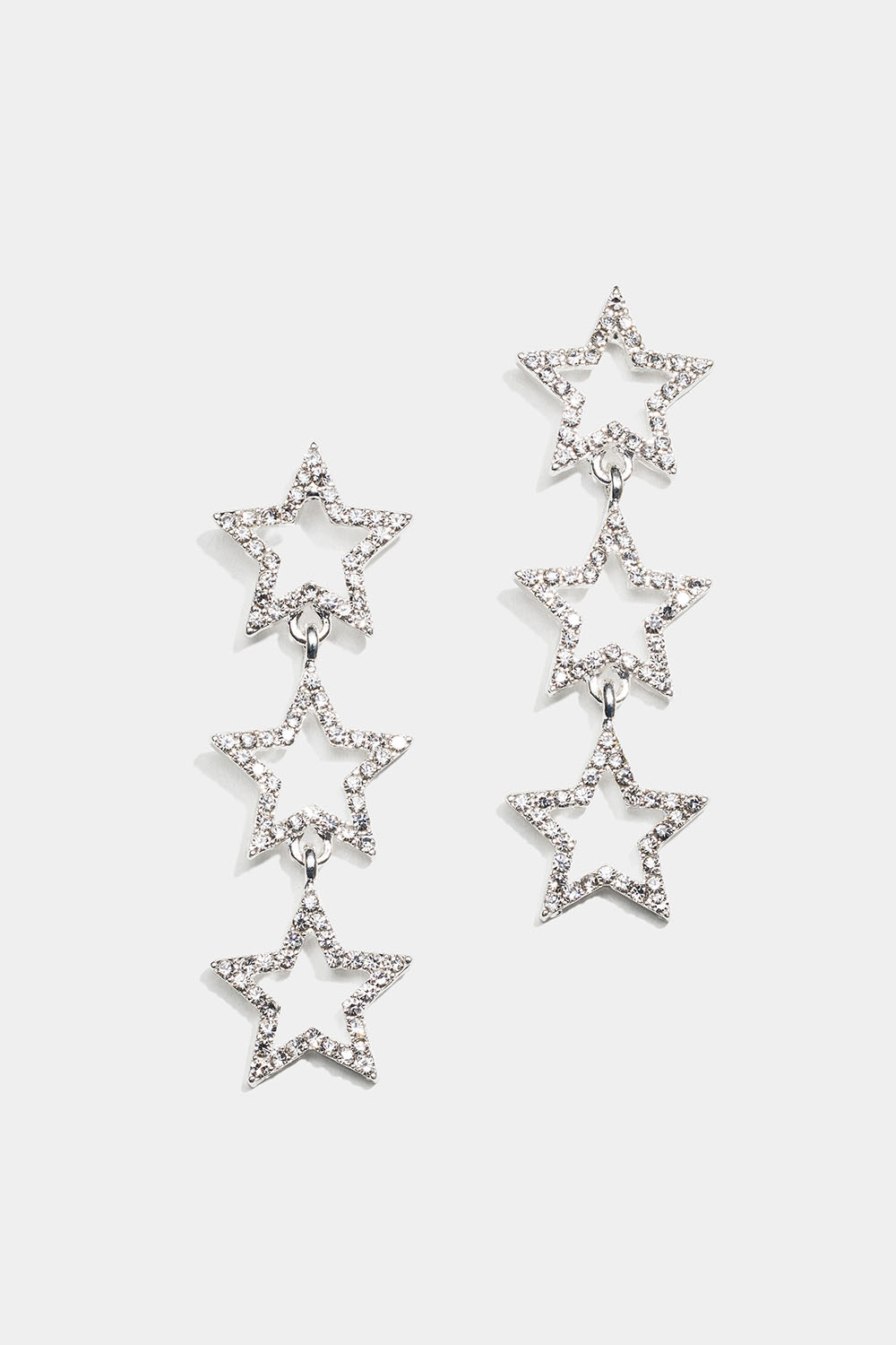 Riippuvat korvakorut kolmella tähdellä ja strasseilla
