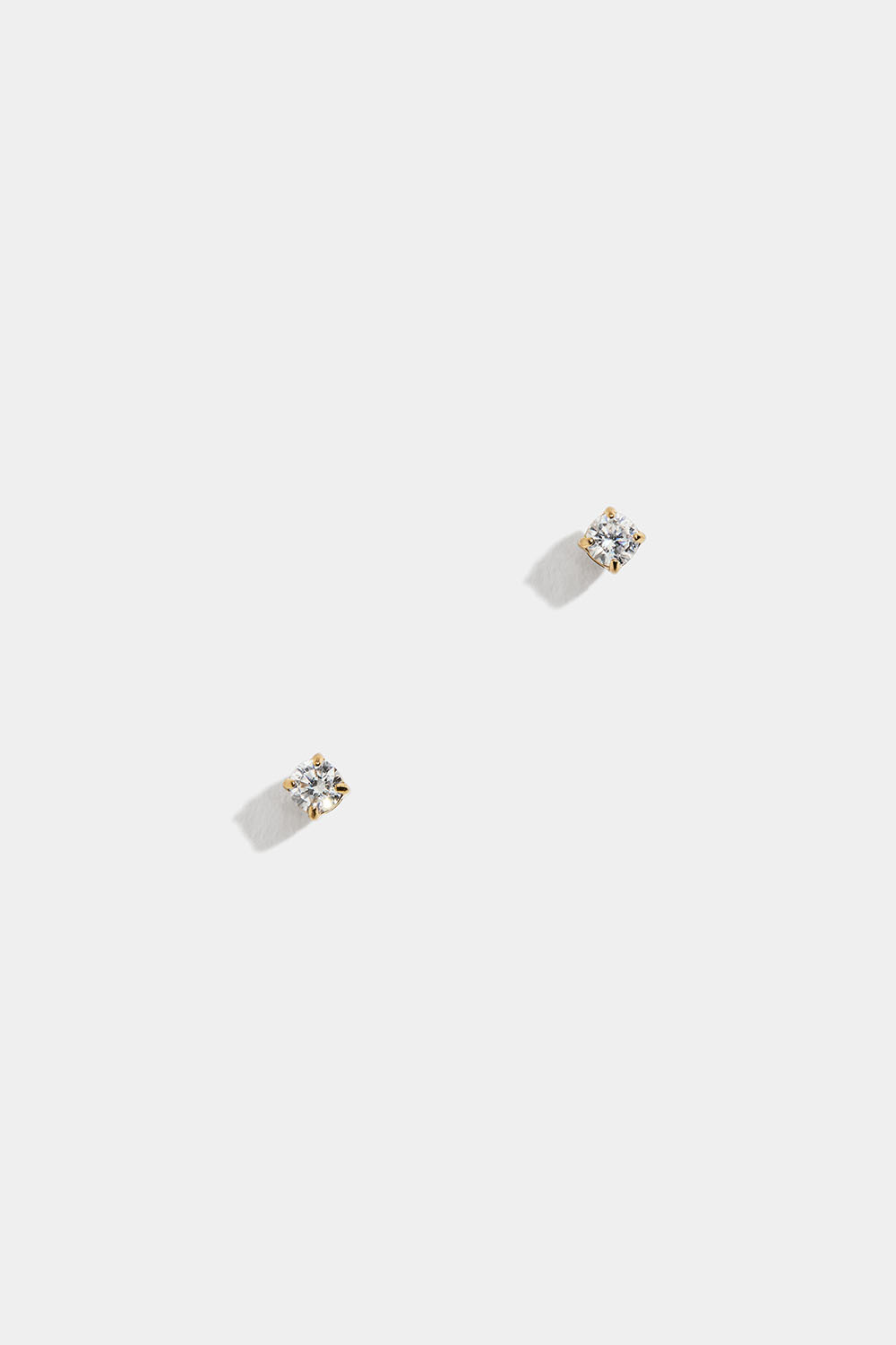 Teräksiset mininappikorvakorut, joissa on 18k kultaus ja Cubic Zirconia -kivi