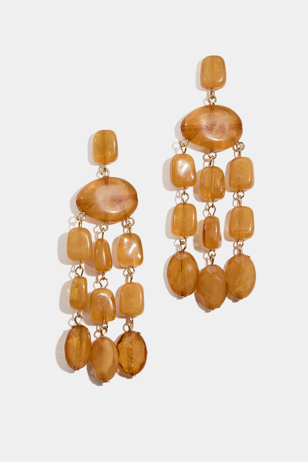 Korvakorut ruskea-oransseilla marmorihelmillä koristeltuina