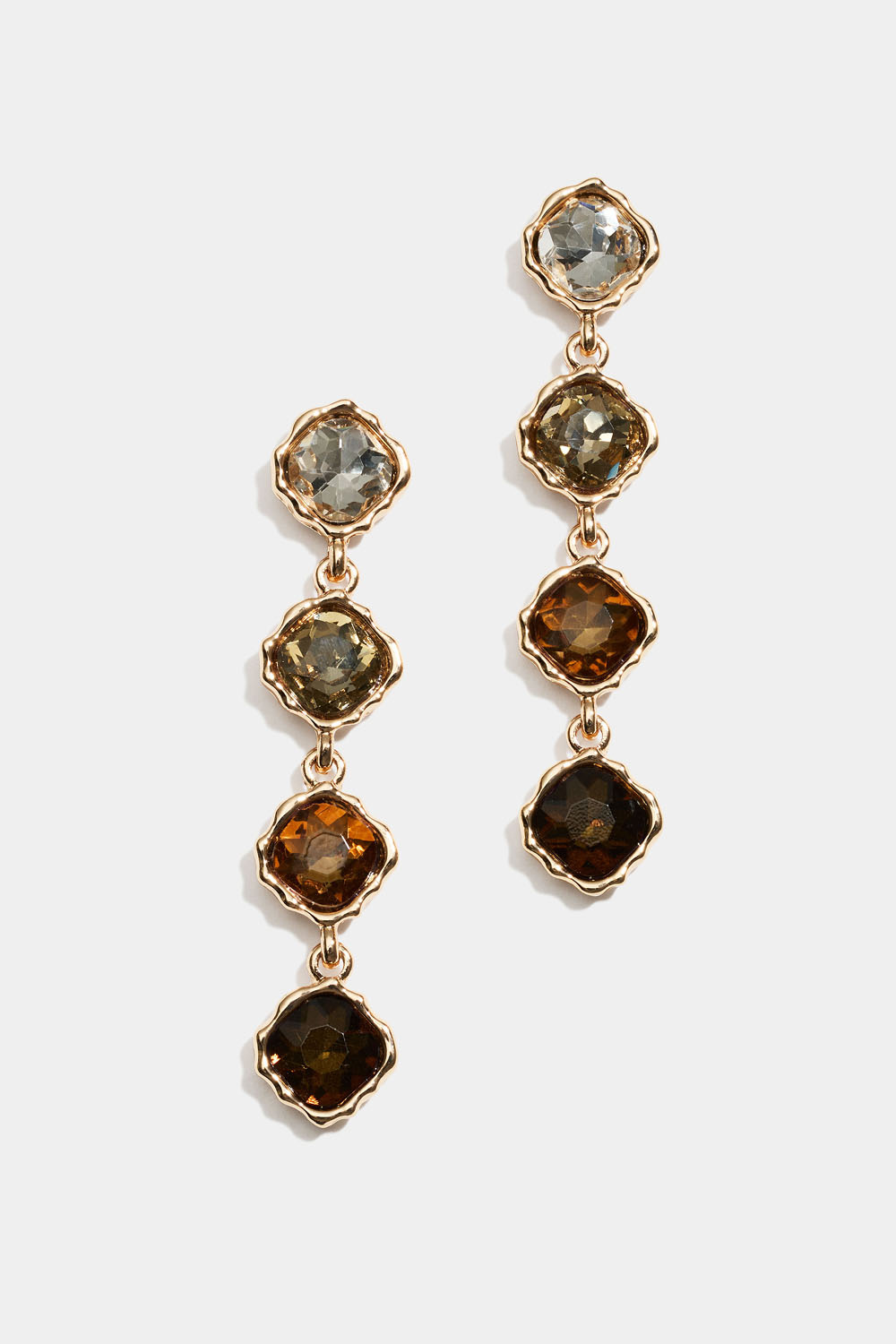 Korvakorut, joissa roikkuvia ruskeita ja valkoisia lasikiviä 