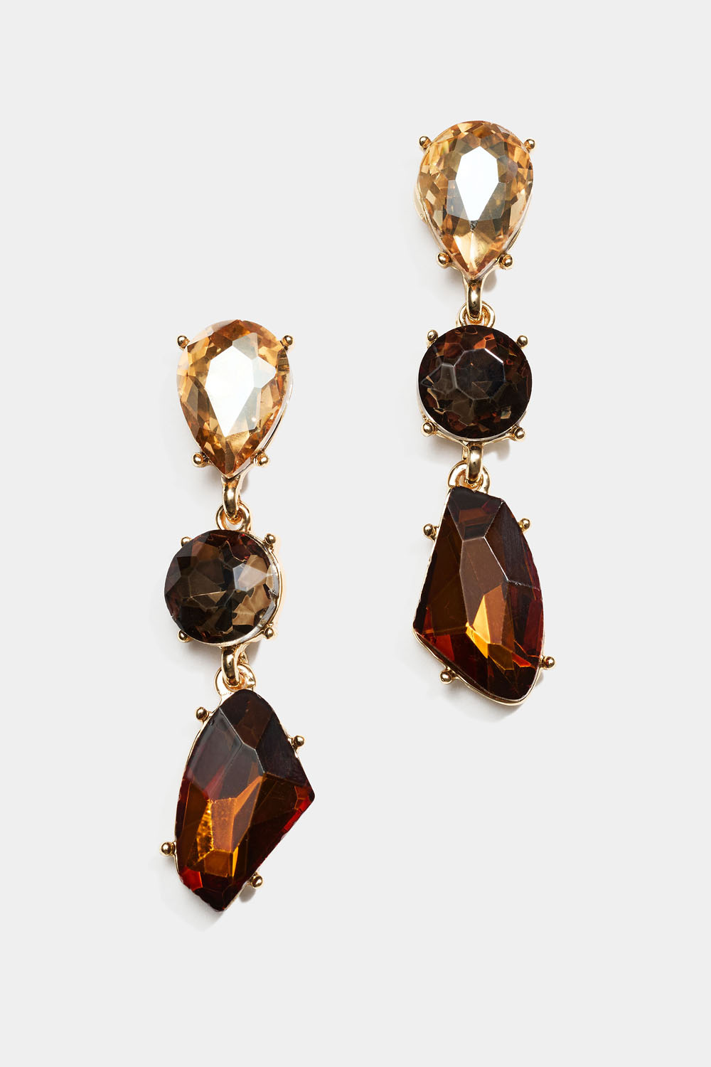 Korvakorut kolmella ruskealla lasikivellä