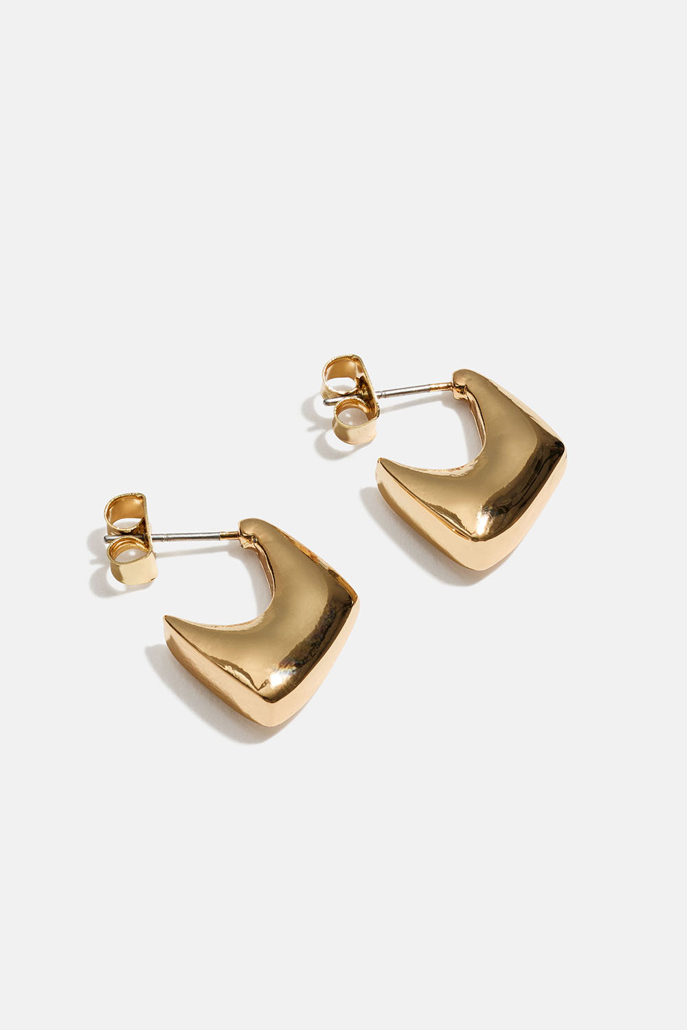 Pienet, kullanväriset kumikkaat korvarenkaat