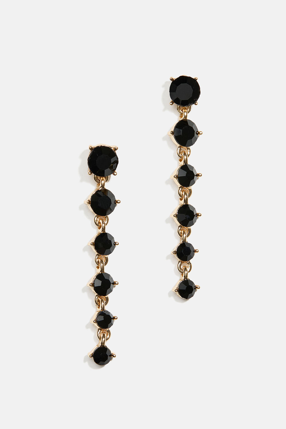 Korvakorut, joissa on mustia pyöreitä lasikiviä