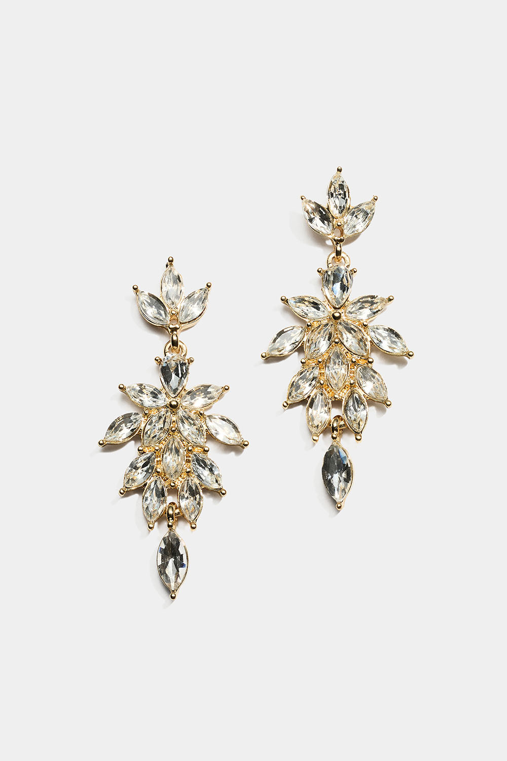 Korvakorut, joissa on valkoisia lehdennmuotoisia lasikiviä