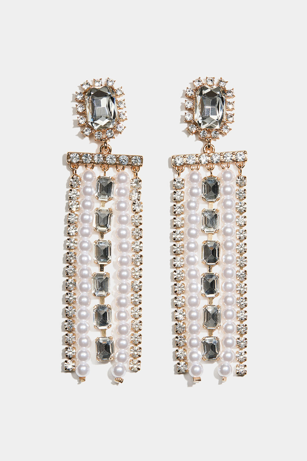 Kullanväriset korvakorut, joissa on suorakulmainen lasikivi ja roikkuivia strassi- ja helmiketjuja