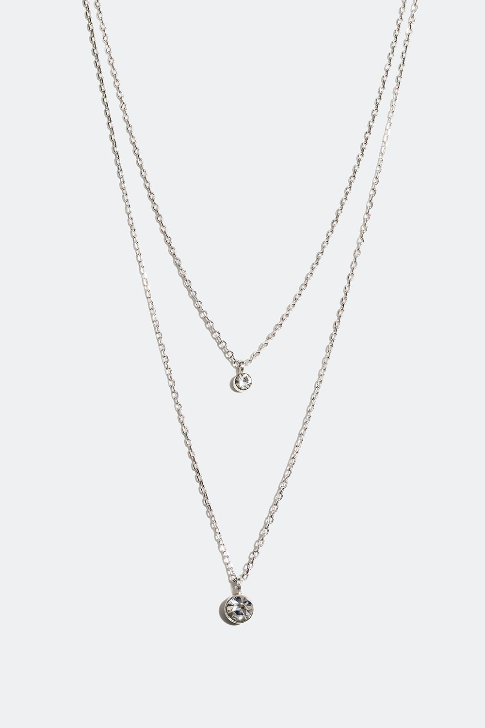 Kaksinkertainen kaulakoru, jossa on kaksi pientä lasikiveä