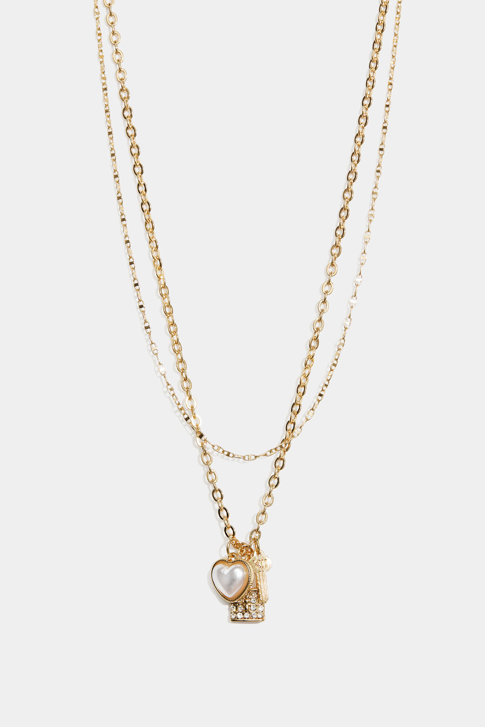 Kaksinkertainen kullanvärinen kaulakoru, jossa sydän, avain ja lukko