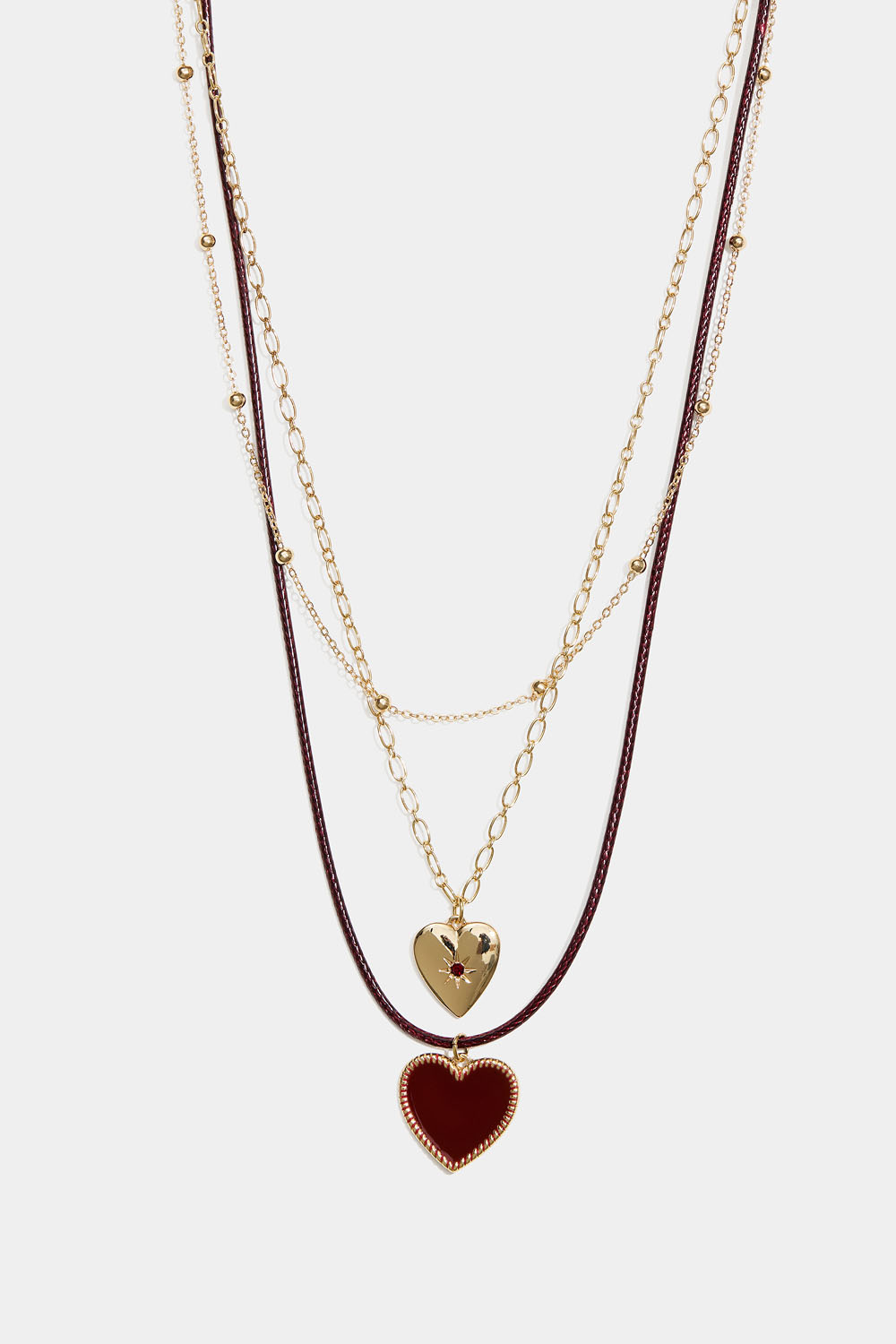Kullanvärinen kolminkertainen kaulakoru, jossa sydämiä ja narua