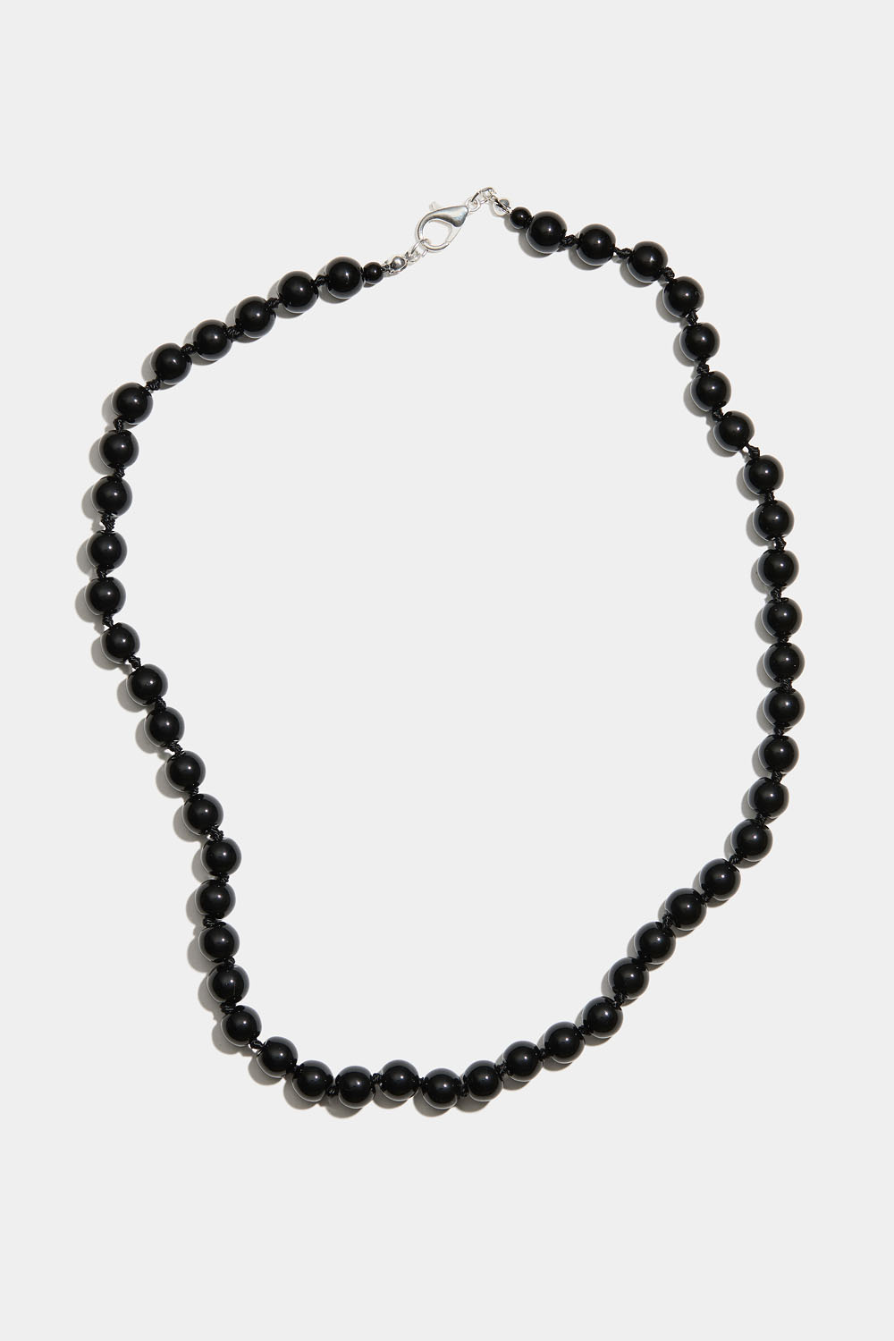 Kaulakoru, jossa mustia lasihelmiä
