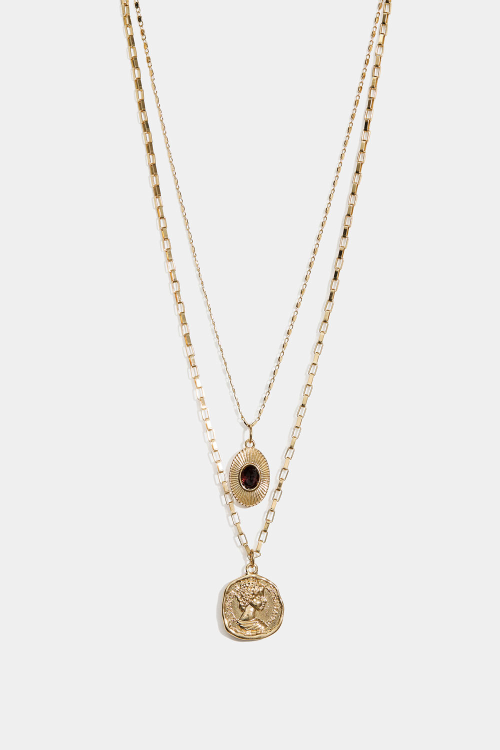 Kaksinkertainen kullanvärinen kaulakoru, jossa kolikkoriipus