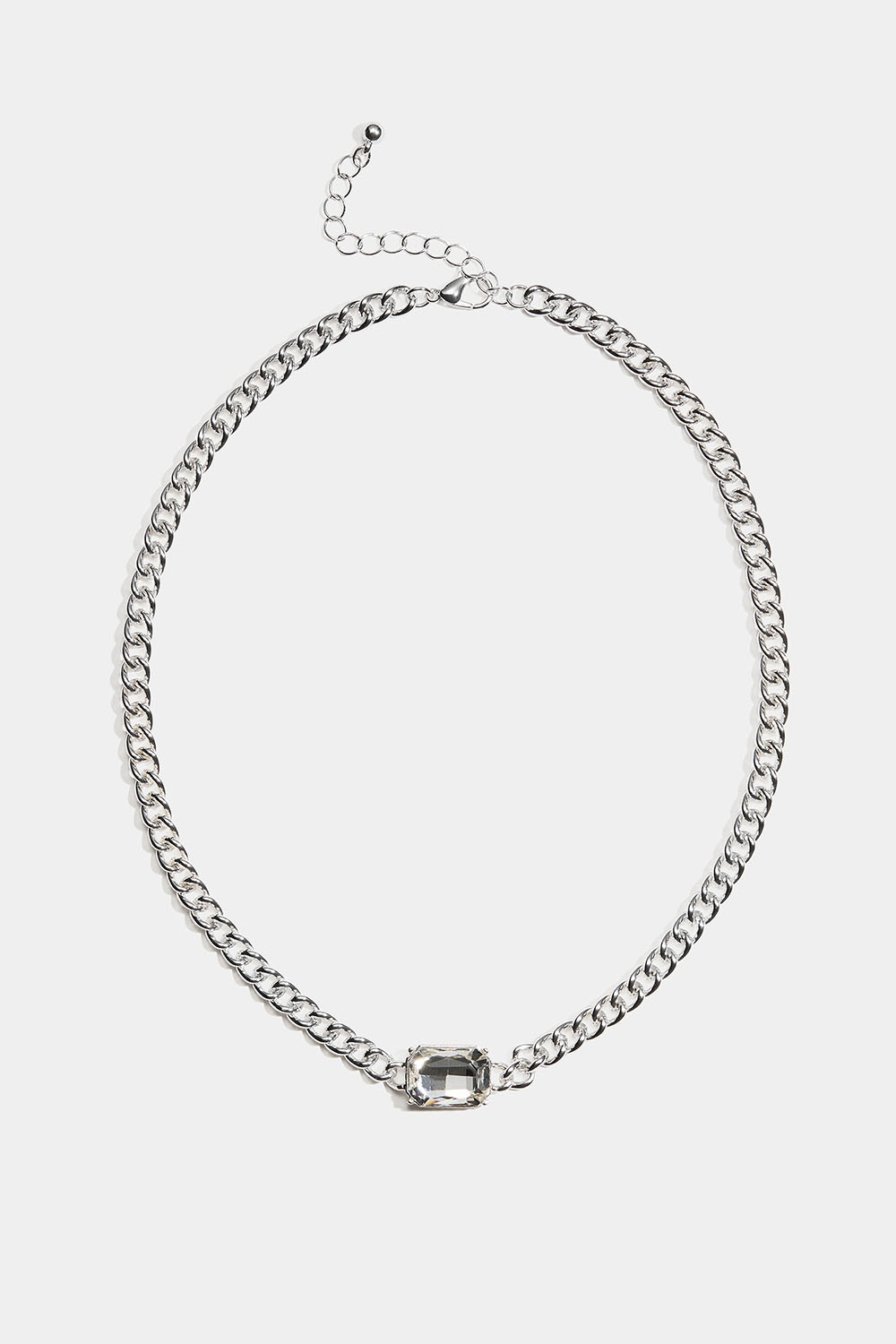 Kaulakoru, jossa on rouhea ketju ja iso lasikivi