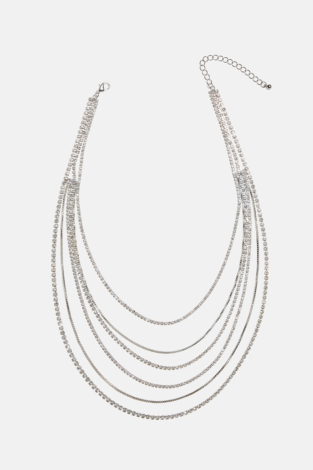 Kerroksellinen kaulakoru, jossa ketjuja ja lasikiviä