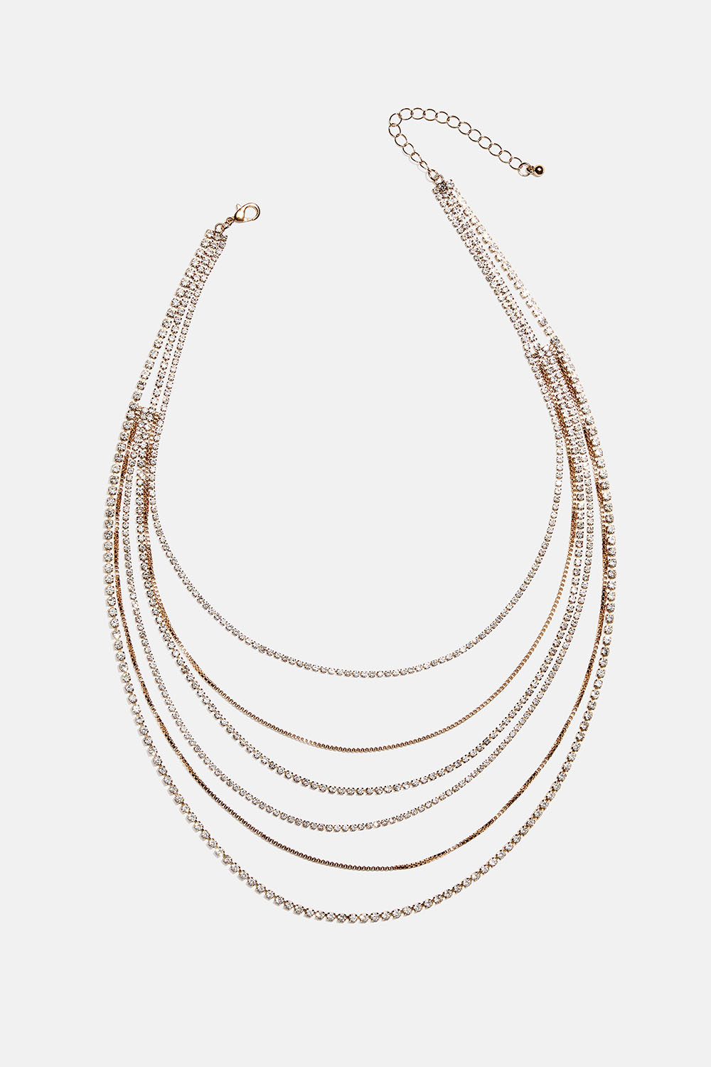 Kerroksellinen kullanvärinen kaulakoru, jossa ketjuja ja lasikiviä