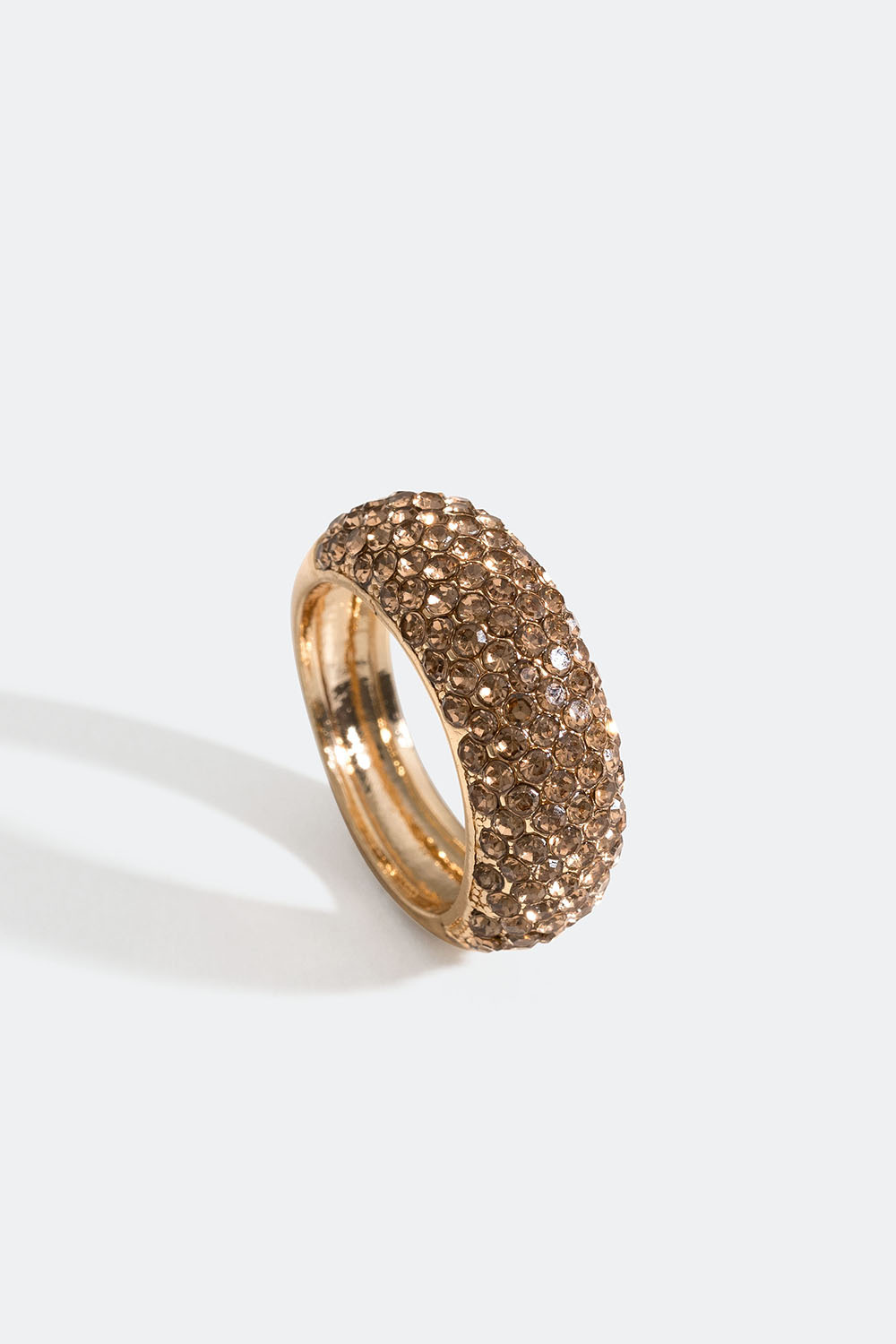 Muhkea kullanvärinen sormus, jossa lasikiviä