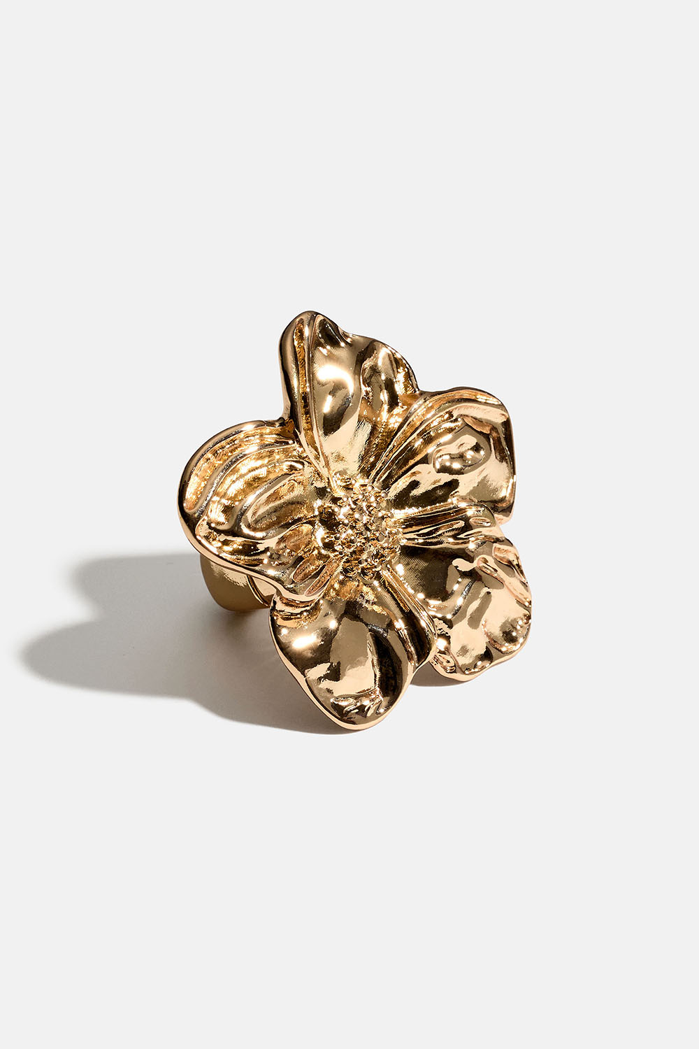 Säädettävä kullanvärinen sormus, jossa kukka