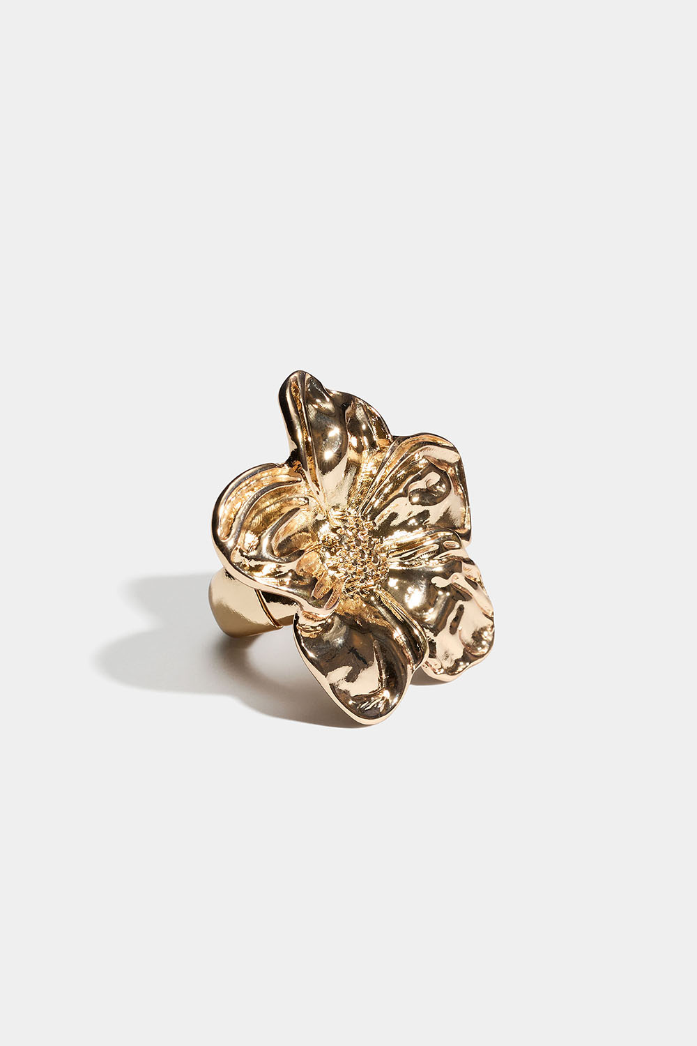 Säädettävä kullanvärinen sormus, jossa kukka