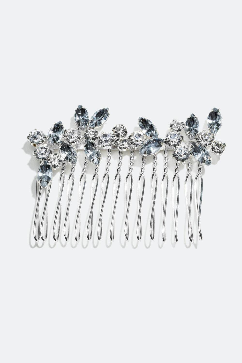 Metallinen hiuskampa lasikivillä