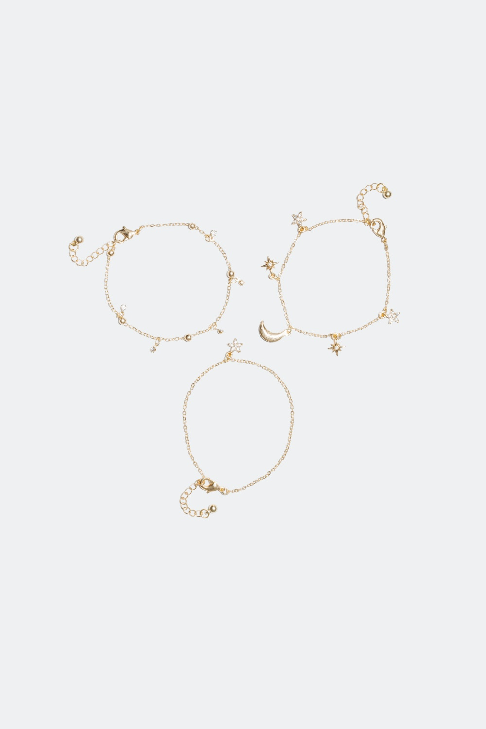 Rannekoru, jossa on tähti- ja kuuriipuksia 