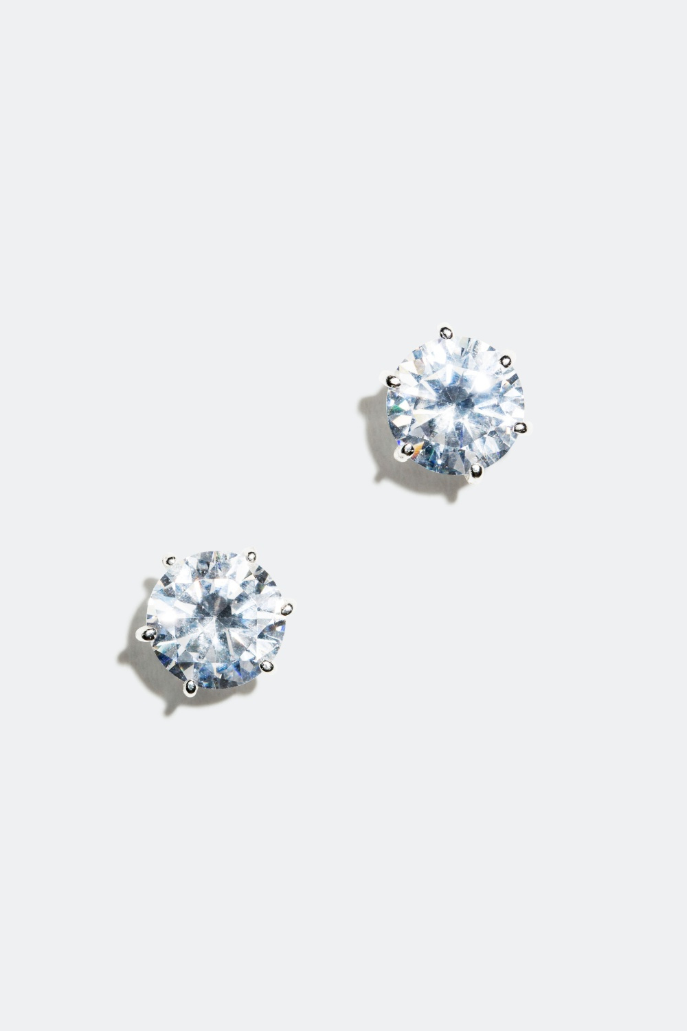 Hopeakorvakorut, joissa pyöreitä lasikiviä