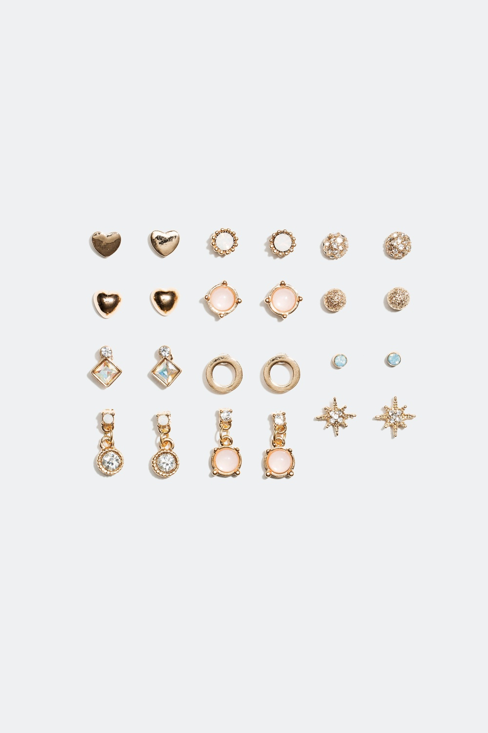 Nappikorvakorut – erimuotoisia koruja, joissa vaaleanpunaisia yksityiskohtia, 12 paria